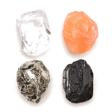 Load image into Gallery viewer, Close-up of the four hand-cut Empower crystals: clear quartz, carnelian, pyrite and black tourmaline
